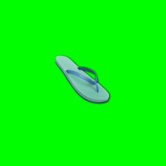 a pair of blue flip flops sitting on top of a green screen