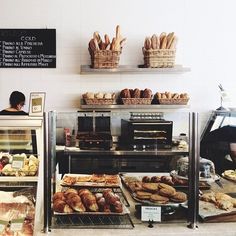 a bakery filled with lots of bread and pastries