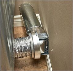 an exhaust fan is shown in the corner of a room with carpeting and walls