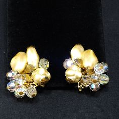 *Description: Perfect for a wedding or any formal occasion, this is a beautiful pair of vintage faux pearl crystal beaded earrings by Robert, who is believed to have been a Miriam Haskell designer. This pair of earrings have a clip on back with a small cushion plastic piece still attached. The earrings are set on a gold tone filigree base with three different designs of faux pearls and Swarovski crystal rhinestones and a gold leaf; all wired to the base giving them a great foundation for years t Elegant Beaded Clip-on Earrings For Formal Occasions, Vintage Beaded Clip-on Earrings For Party, Vintage Clip-on Wedding Earrings, Vintage Clip-on Bridal Earrings For Wedding, Sparkling Clip-on Earrings For Evening, Vintage Wedding Clip-on Earrings, Vintage Clip-on Crystal Earrings For Wedding, Vintage Pearl Earrings For Evening, Vintage Crystal Earrings For Wedding