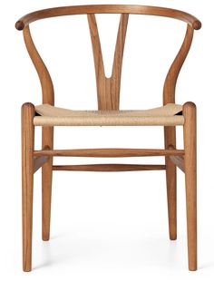 the wish chair is made from solid wood and has a woven seat pad on one side