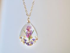 This necklace features Gladiolus, the birth flower for August, carefully preserved in a clear resin pendant. Gladiolus is symbolic of strength of character, faithfulness, moral integrity, and remembrance, making this necklace a perfect personalized birthday gift. Material: 14k gold filled chain and components or Silver, Resin Flower: Real Pressed Flower Chain Length: 18" (45cm)  Pendant Width: 0.79" (2cm) Pendant Height: 0.98" (2.5cm) Every pieces is made by hand and unique, therefore each piece Clear Flower Pendant Necklace As Gift, Clear Flower Shaped Birth Flower Jewelry, Clear Flower-shaped Birth Flower Jewelry, Clear Flower Pendant Necklace For Gift, Clear Necklace With Pressed Flowers For Gift, Clear Necklaces With Pressed Flowers As A Gift, Clear Necklaces With Pressed Flowers For Gifts, Clear Flower-shaped Necklace For Gift, Clear Flower Necklace For Gift