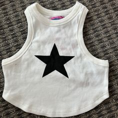 Cute Star Tank Top Never Worn With Tags! Casual Summer Tops With Star Logo, Casual Black Top With Star Patch, Trendy Black Top With Star Patch, Trendy Streetwear Tops With Star Patch, Trendy Star Patch Tops For Spring, Trendy Tops With Star Patch For Spring, Trendy Spring Tops With Star Patch, White Tops With Star Logo For Streetwear, White Star Logo Top For Streetwear