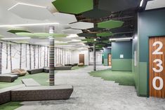 the interior of an office building with green and white carpet