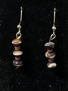 Hello and welcome to my store! You are looking at a pair of brown and white disc earrings. They have brown and white beads that are shaped like discs and brown seed beads. The disc beads are made of czech glass. These earrings dangle to 1.5 inches long and they are on gold fishhooks. I will include earring backs upon purchase. Thanks for looking! Nickel-free Brown Beaded Earrings With Czech Glass, Brown Czech Glass Beaded Drop Earrings, Brown Czech Glass Earrings With Dangling Beads, Nickel-free Brown Czech Glass Beaded Earrings, Brown Czech Glass Bead Earrings, Brown Beaded Czech Glass Earrings, Beaded Brown Czech Glass Earrings, Nickel Free Brown Beaded Drop Earrings, Nickel-free Brown Beaded Drop Earrings