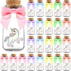 a glass jar filled with lots of different colored unicorns and bows on the top