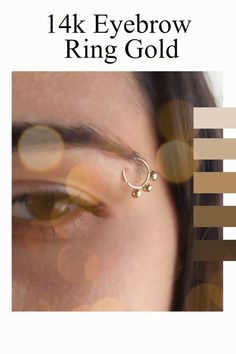 the front cover of a magazine with an image of a woman's eye and nose piercing