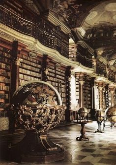 an ornate library with many bookshelves and tables