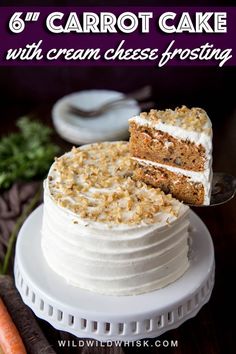 carrot cake with white frosting and crumbs on top