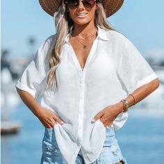 Have some fun in the sun in this semi-sheer cover-up shirt featuring a V-neckline, basic collar, button-front closures, and short sleeves with rolled cuffs. Crafted from a semi-sheer fabric, this cover-up shirt offers a lightweight and breathable feel, ideal for hot summer days. The semi-sheer quality adds a hint of allure and allows for a peekaboo effect, showcasing your swimsuit underneath. Product code:CAA07A3B003CC/CAA07A3B003GG/CAA07A3B003SS/CAA07A3B003UU Model Wearing Size: S Height:5‘6" i Chic Short Sleeve Beach Cover-up, Breezy Short Sleeve Cover-up For Vacation, Beachy Short Sleeve Beach Cover-up Top, Fitted Short Sleeve Beachwear Cover-up, Casual Button-up Top For Beach Cover-up, White Cover Up, Sheer Cover Up, White Cover, Sheer Fabric