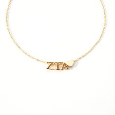 a gold bracelet with the word ava on it