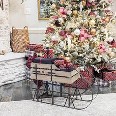 a decorated christmas tree with presents under it