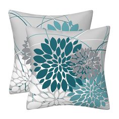 two pillows with blue and gray flowers on them