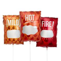 three red and orange foil balloons with the words hot, mild, and fire printed on them