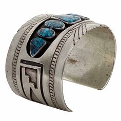 Navajo artist Hyson Craig is an amazing talent. Some say many artists have made a career out of using a Hyson Craig style. This bracelet showcases seven incredible pieces of collectible Nevada turquoise, Red Mountain. The stones are deep blue with fascinating spider web matrix. Hyson designs the bracelet to have an eye pleasing Navajo rug weaving decoration on each end. Plus, he sets the seven great stones in a shadowbox setting. The bracelet has a solid feel and is something that will wear very comfortable. This is a very impressive piece of art that is a one-of-a-kind by Hyson.   Total Circumference - 6 3/4" Opening - 1 3/8" Width - 1 1/2" Weight - 78.3 grams Vintage Turquoise Cuff Bracelet With Concho, Vintage Turquoise Cuff Bracelet, Luxury Southwestern Kingman Turquoise Cuff Bracelet, Navajo Rug, Red Mountain, Southwestern Blue Nickel-free Cuff Bracelet, Rug Weaving, Navajo Rugs, Bohemian Turquoise Nickel-free Cuff Bracelet