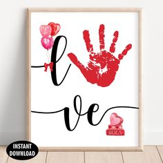 a valentine's day print with the word love and handprinted red hearts