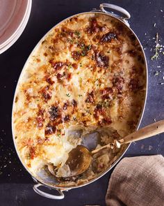 a casserole dish with meat and vegetables in it