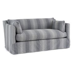 a gray and white striped couch with pillows