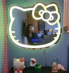 there is a hello kitty light up mirror on the wall