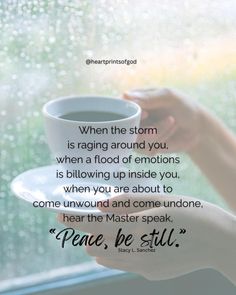 someone holding a coffee cup in their hand with the words, when the storm is raging around you, it's following up inside you