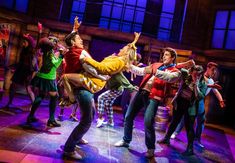 a group of young people dancing on stage