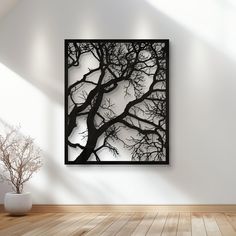 a black and white photo hanging on the wall