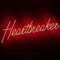 a red neon sign that reads heartbeater