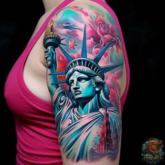 the statue of liberty is painted on her arm and it looks like she's holding a torch