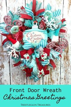 the front door wreath for christmas is decorated with red, white and blue ribbon bows