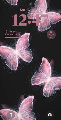 three pink butterflies flying in the air