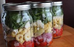 three mason jars filled with different types of food