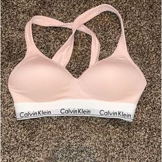 Light Pink Calvin Klein Bra Size Small Never Worn Super Cute! Pink Calvin Klein, Calvin Klein Bra, Calvin Klien, Black And White Logos, Cotton Bralette, Crop Bra, Gray Sports Bra, Padded Bralette, Black Lace Bralette