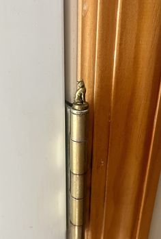 an open door with a metal handle on it