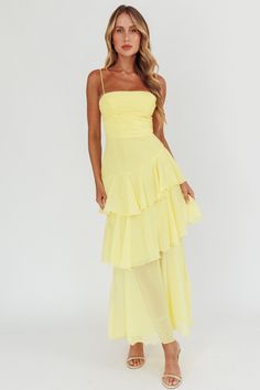 Back in stock! Our Parisian Summer Yellow Tiered Maxi Dress is the perfect wedding guest dress or sorority formal dress! Featuring a ruched bodice, spaghetti straps and a playful asymmetrical tiered skirt. Zipper back. Flowy Formal Dress, Positano Dress, Sorority Formal Dress, Asymmetrical Tiered Skirt, Yellow Bridesmaid, Digital Wardrobe, Parisian Summer, Cute Formal Dresses, Prom 2024