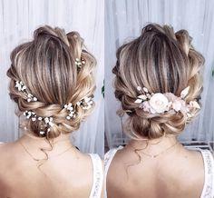 two women with braids and flowers in their hair, one wearing a white dress