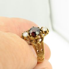 Estate 14k yellow gold almandine garnet and diamond ring size 6. great shape. 4.4 grams. 14.8mm wide. 5.7mm natural almandine garnet and 2 3.8mm diamonds. mark fadded acid tests for 14k. Vintage Garnet Birthstone Ring For Wedding, Victorian Garnet Rings For Anniversary, Vintage Garnet Rings With Rose Cut Diamonds, Garnet And Diamond Ring, Baby Rings, Almandine Garnet, Garnet Gem, Wide Band Rings, Blue Band