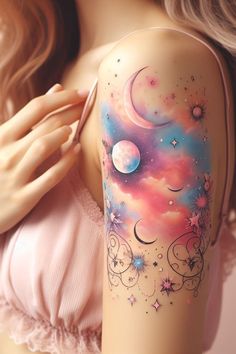 a woman's arm with an artistic tattoo on it and the image of planets