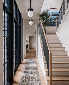 the hallway is clean and ready for guests to use it as a focal point in this house