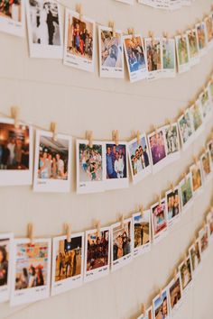 many pictures are hanging on the wall with clothes pins attached to them and pinned together