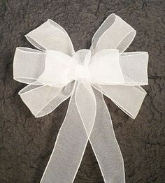 a white ribbon with a bow on it