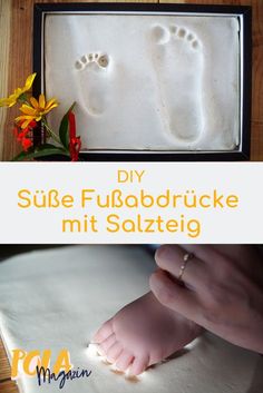 a baby's foot and hand casting in white clay with the words diy sube fumbodrucke mit soltzei