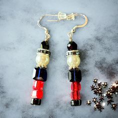 These spectacular earrings are Nutcrackers made from large Swarovski crystals and pearls on sterling silver wires. Dazzling, festive earrings to help celebrate the holiday season. Nutcracker Earrings, Festive Earrings, Bah Humbug, Xmas Ideas, Pearl Crystal, Swarovski Pearls, Nutcracker, Silver Wire, Sterling Silber