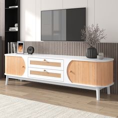 a white and wood entertainment center in a living room