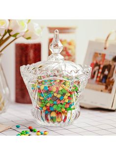 a glass bowl filled with lots of candy