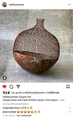 the vase is made out of copper wire