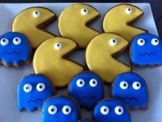 cookies decorated with blue and yellow icing are arranged in the shape of numbers