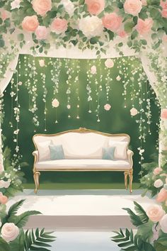 a white couch sitting in front of a lush green wall with flowers and greenery