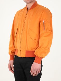 Long-sleeved orange jacket. It features front zip closure, two side buttoned flap pockets, one zipped pocket on left sleeve and contrasting details on neck, cuffs and hem. The model is 184cm tall and wears size 48. Size nationality: IT Product number: 35774814 Product code: 22CTCUC04064A06105434 Composition: 60% polyester, 40% polyamide Classic Long Sleeve Orange Outerwear, Classic Orange Outerwear For Work, Orange Track Jacket For Fall Streetwear, Orange Long Sleeve Track Jacket For Fall, Long Sleeve Orange Track Jacket For Fall, Orange Long Sleeve Outerwear With Pockets, Orange Long-sleeve Outerwear With Pockets, Classic Orange Outerwear For Spring, Orange Collared Outerwear For Work