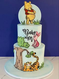 a three tiered winnie the pooh birthday cake