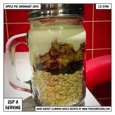 a glass jar filled with granola and yogurt